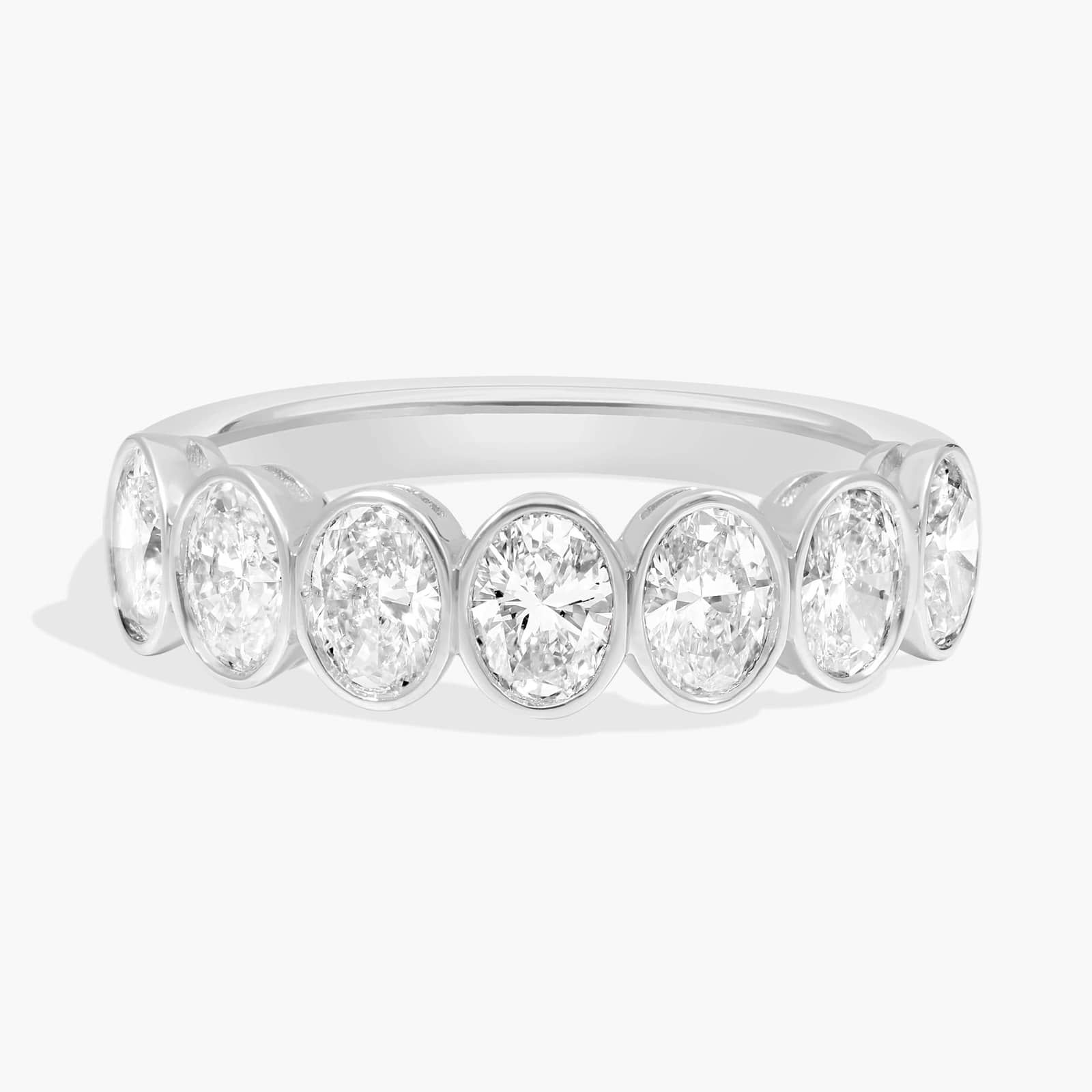 Seven Stone Bezel Anniversary Ring With 1.5 CTW Oval Cut Diamonds in 14K White Gold (5mm)