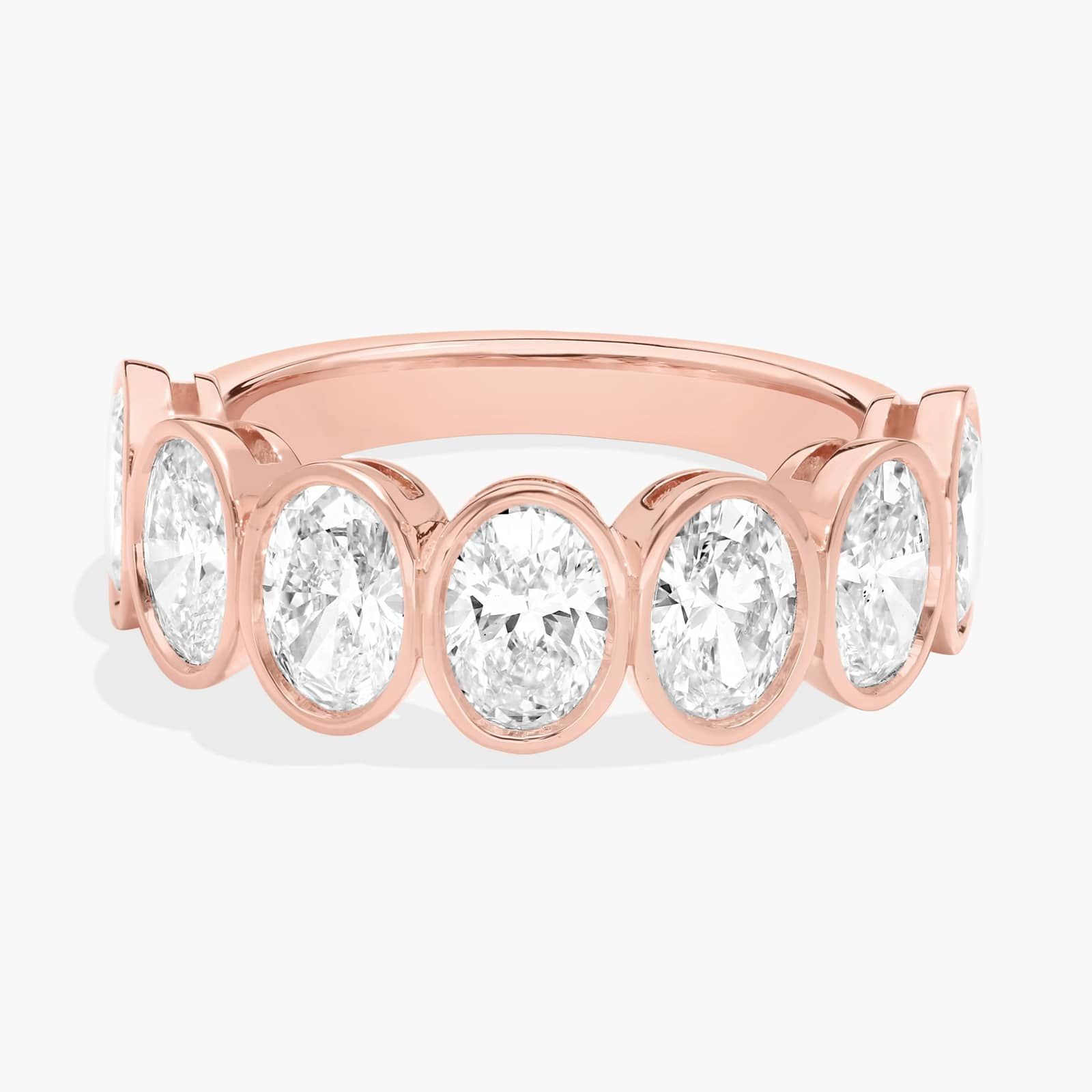 Seven Stone Bezel Anniversary Ring With 3 CTW Oval Cut Diamonds in 14K Rose Gold (6.7mm)