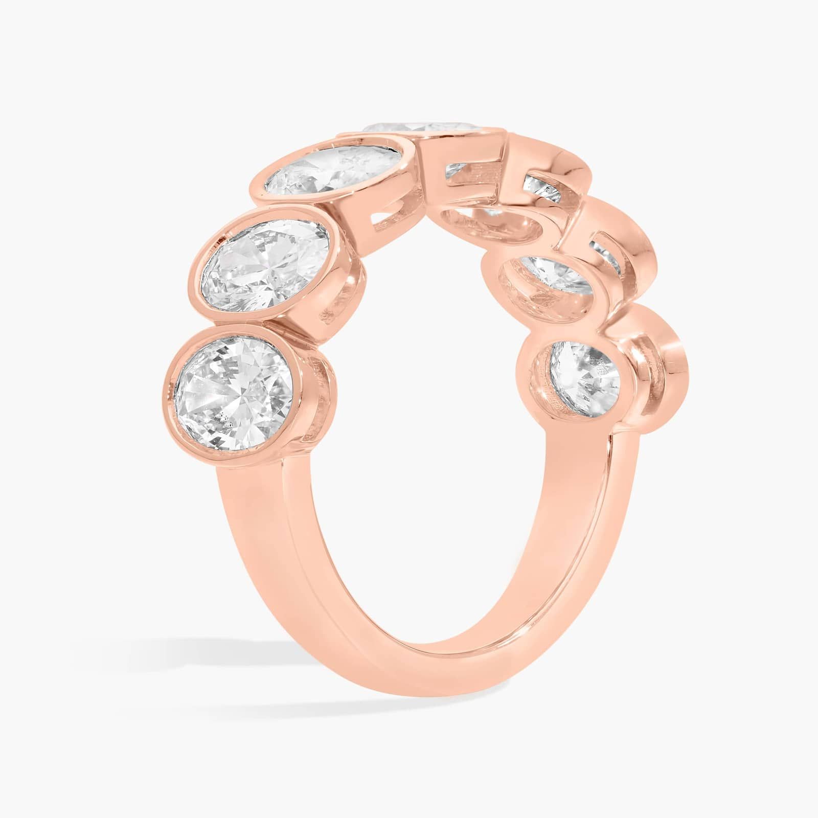 Seven Stone Bezel Anniversary Ring With 3 CTW Oval Cut Diamonds in 14K Rose Gold (6.7mm)