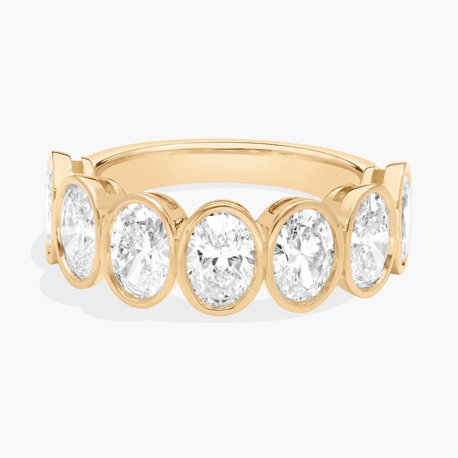 Seven Stone Bezel Anniversary Ring With 3 CTW Oval Cut Diamonds in 14K Yellow Gold (6.7mm)
