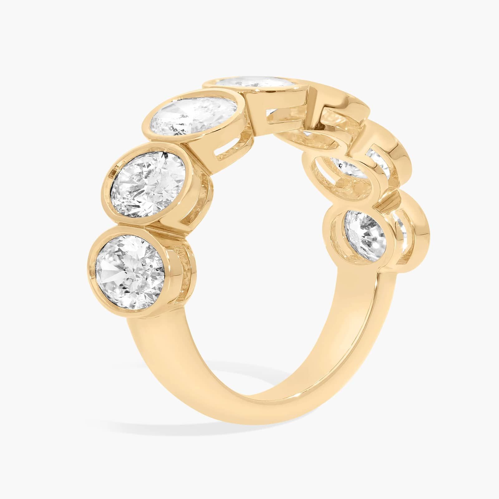 Seven Stone Bezel Anniversary Ring With 3.5 CTW Oval Cut Diamonds in 14K Yellow Gold (7.4mm)
