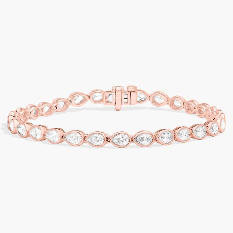 East-West Bezel Tennis Bracelet With 5 CTW Pear Shaped Diamonds in 14K Rose Gold