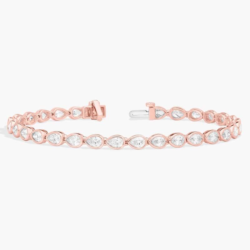 East-West Bezel Tennis Bracelet With 5 CTW Pear Shaped Diamonds in 14K Rose Gold