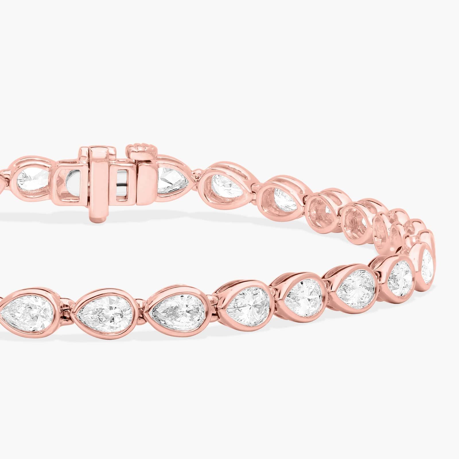 East-West Bezel Tennis Bracelet With 5 CTW Pear Shaped Diamonds in 14K Rose Gold