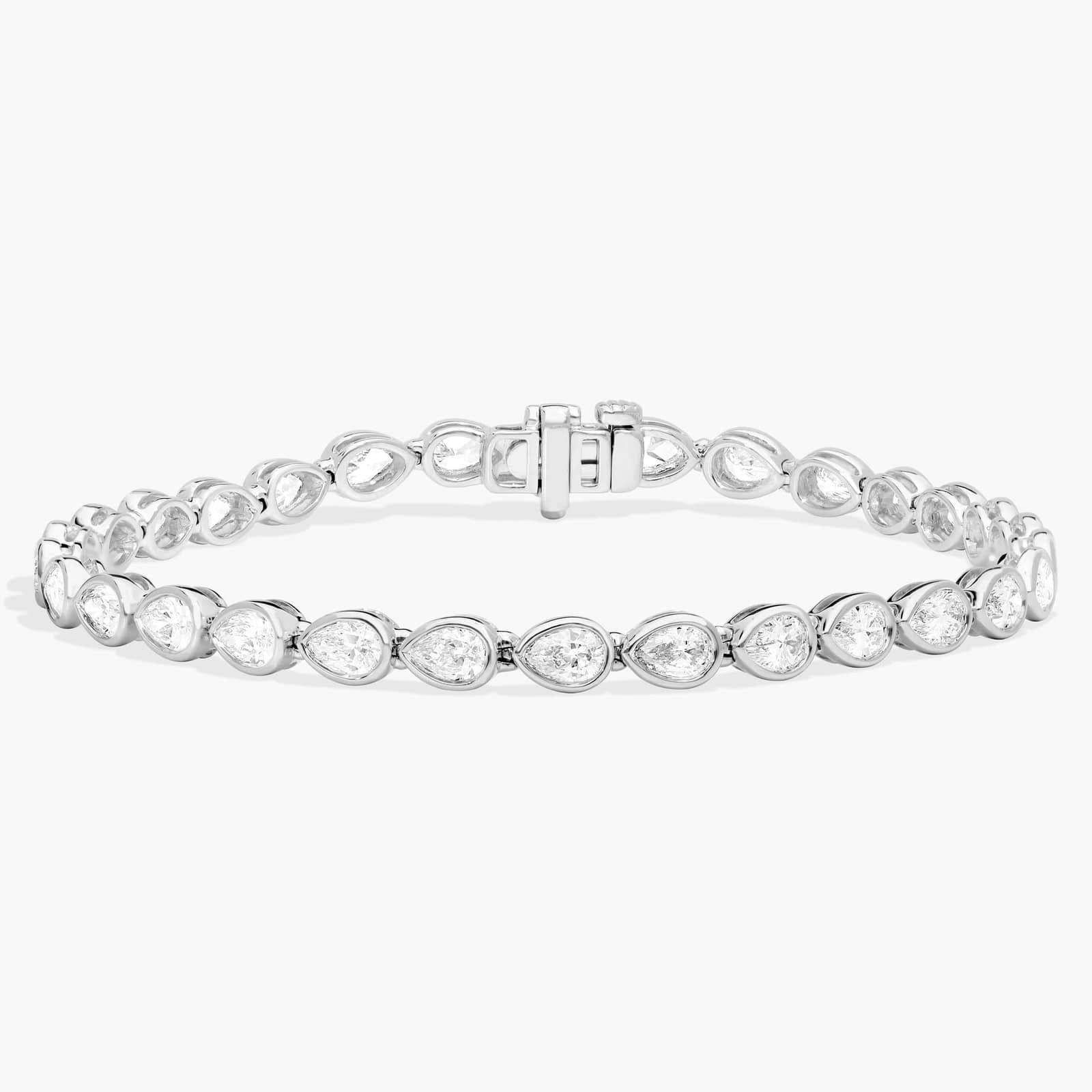 East-West Bezel Tennis Bracelet With 5 CTW Pear Shaped Diamonds in Platinum