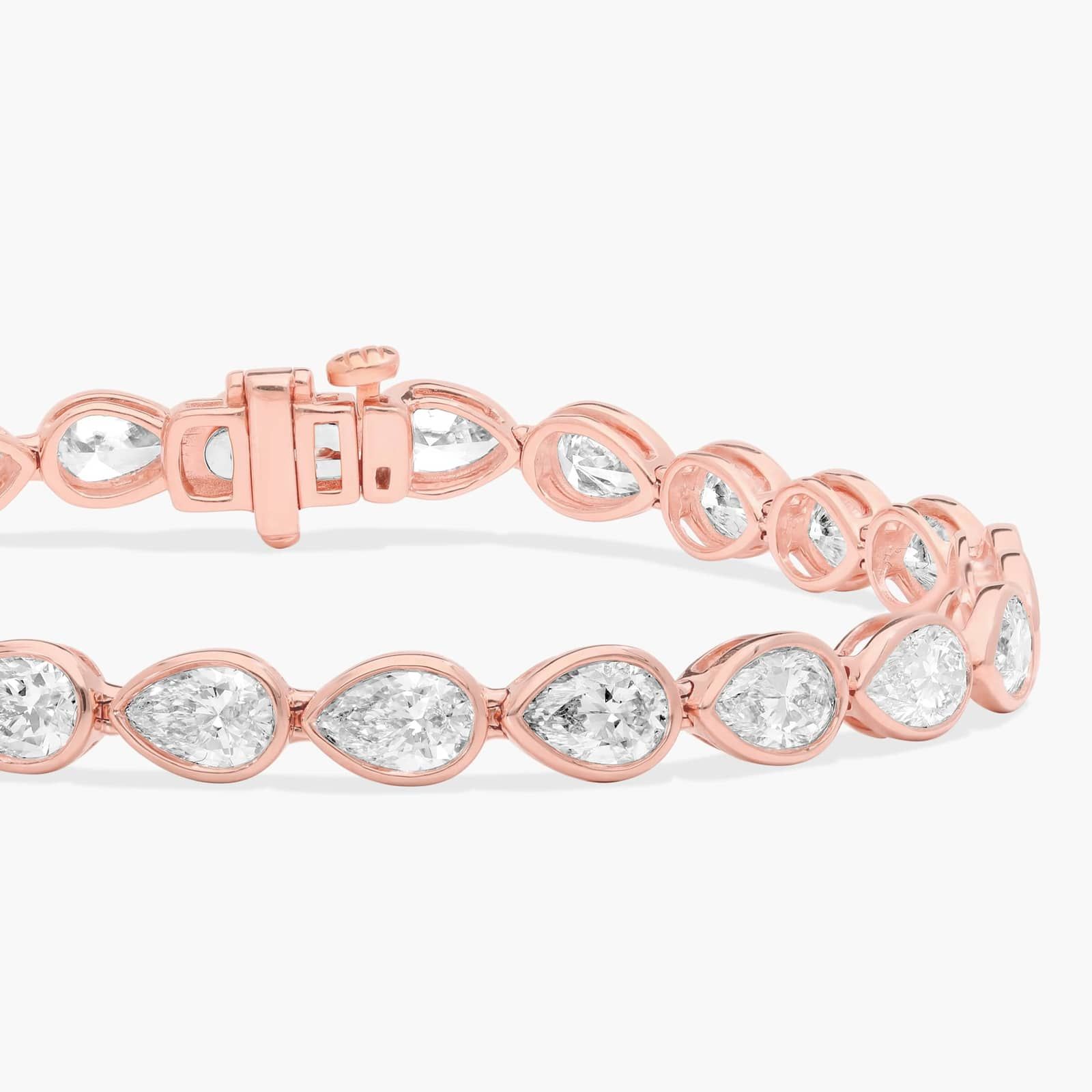 East-West Bezel Tennis Bracelet With 8 CTW Pear Shaped Diamonds in 14K Rose Gold