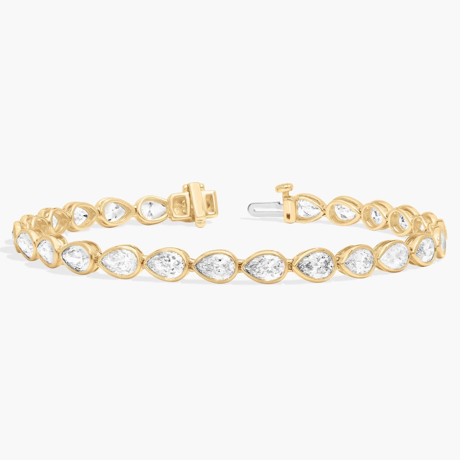 East-West Bezel Tennis Bracelet With 8 CTW Pear Shaped Diamonds in 14K Yellow Gold
