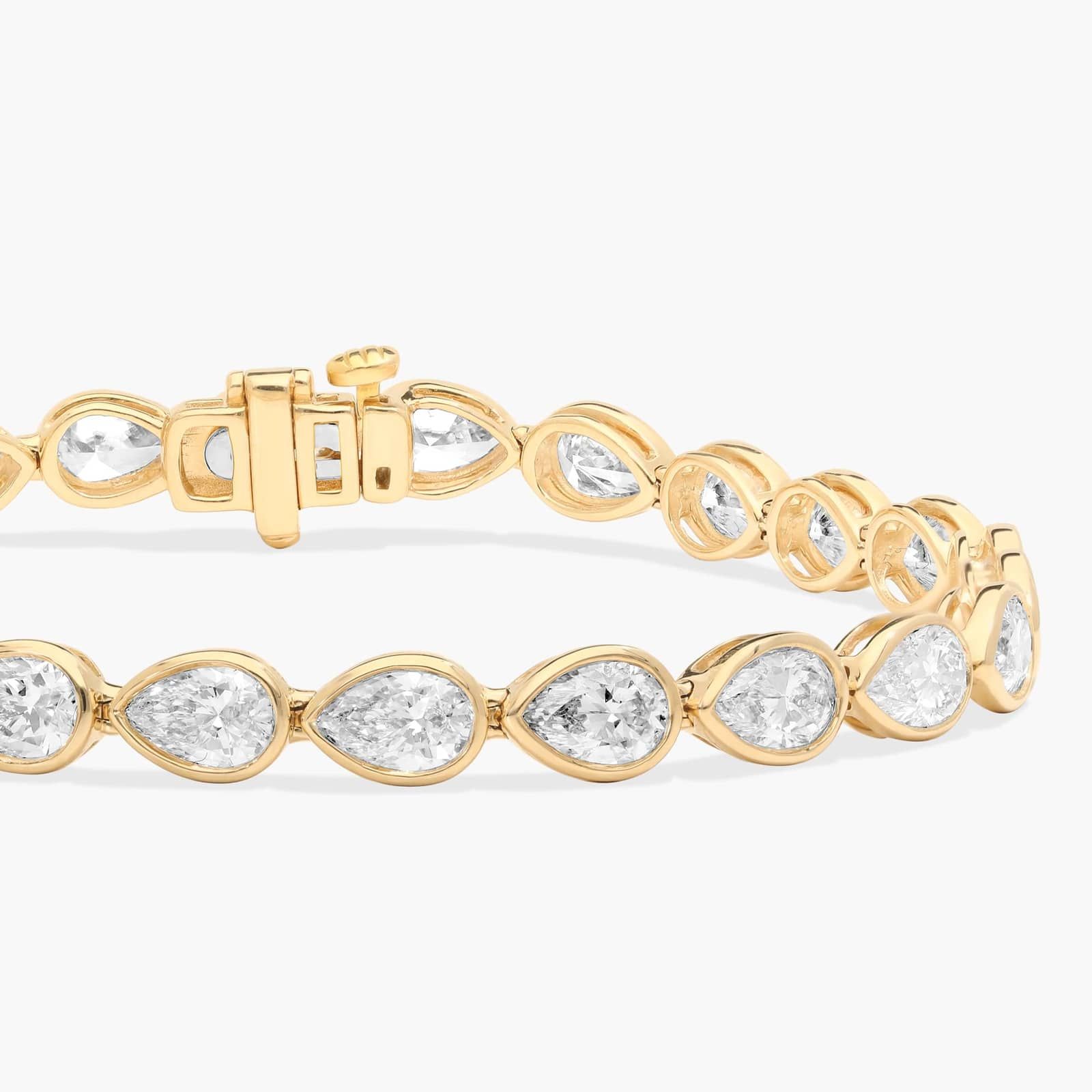 East-West Bezel Tennis Bracelet With 8 CTW Pear Shaped Diamonds in 14K Yellow Gold
