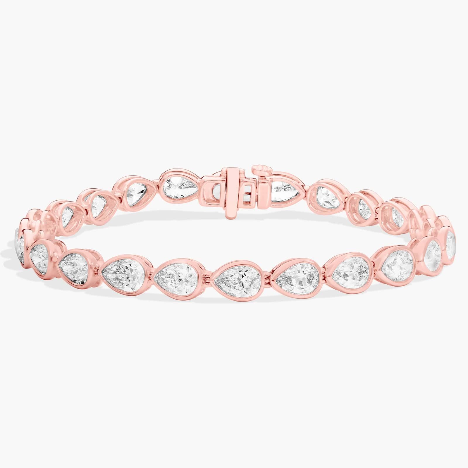 East-West Bezel Tennis Bracelet With 10 CTW Pear Shaped Diamonds in 14K Rose Gold