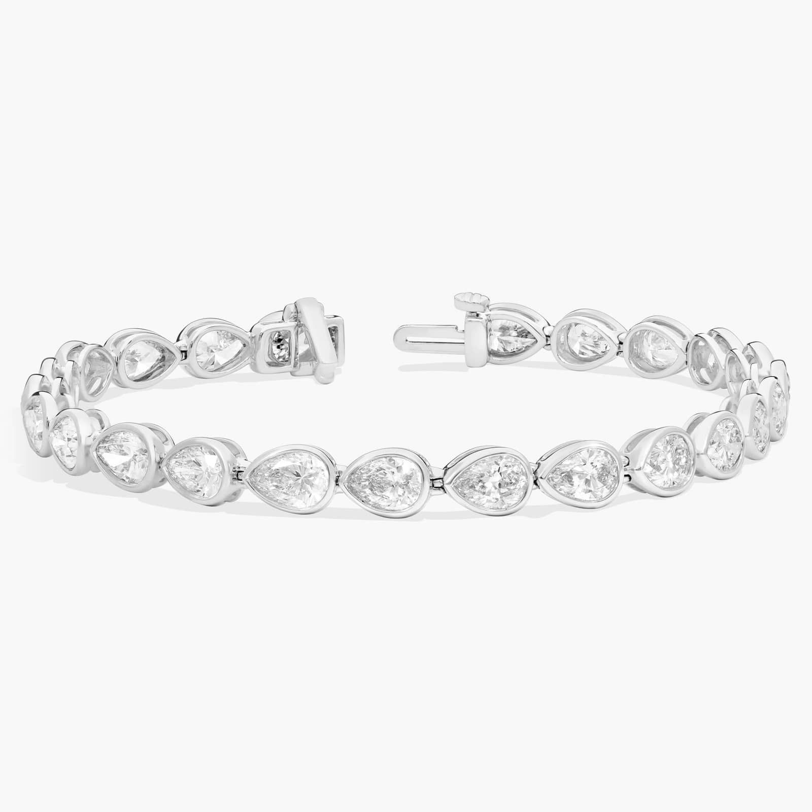 East-West Bezel Tennis Bracelet With 10 CTW Pear Shaped Diamonds in Platinum