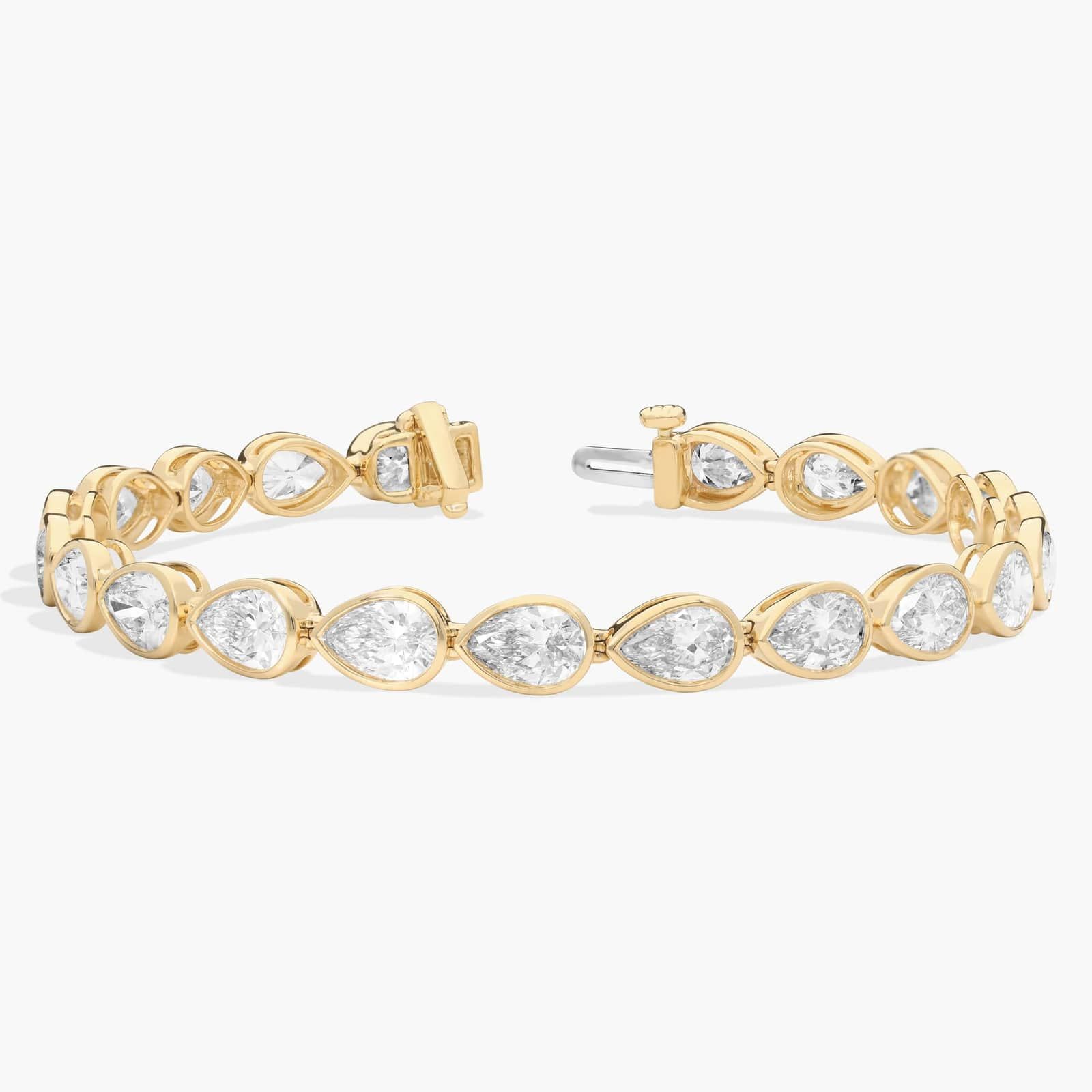 East-West Bezel Tennis Bracelet With 12 CTW Pear Shaped Lab-Grown Diamonds in 14K Yellow Gold