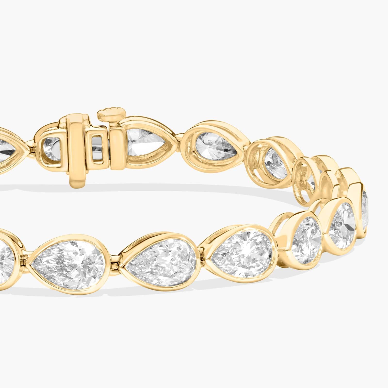 East-West Bezel Tennis Bracelet With 12 CTW Pear Shaped Lab-Grown Diamonds in 14K Yellow Gold