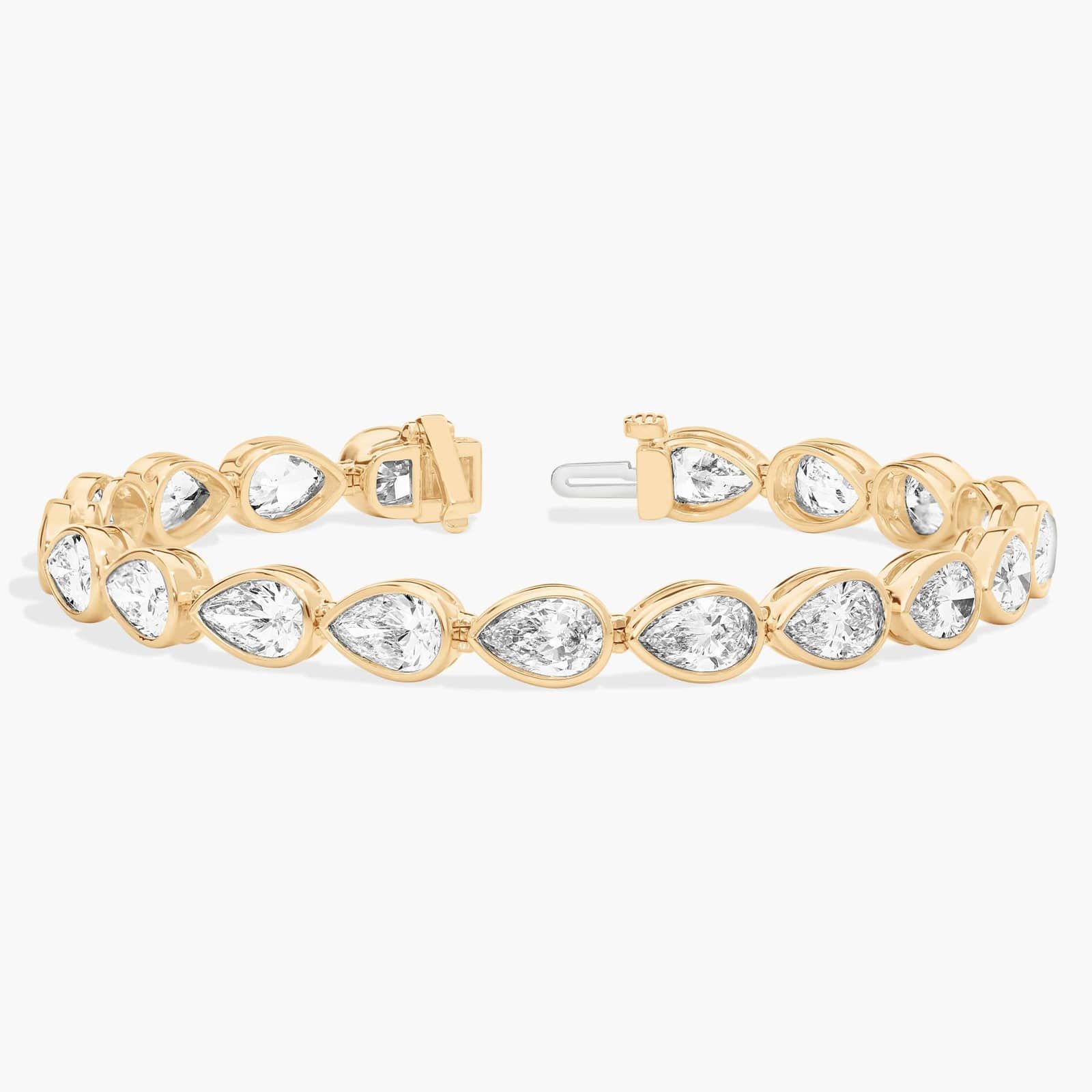 East-West Bezel Tennis Bracelet With 15 CTW Pear Shaped Lab-Grown Diamonds in 14K Yellow Gold