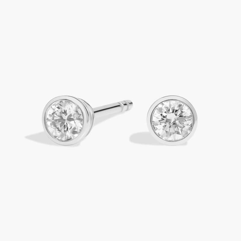 Bezel Set Diamond Stud Earrings In Platinum (1/4 Ct. tw. - H-I / SI1-SI2)