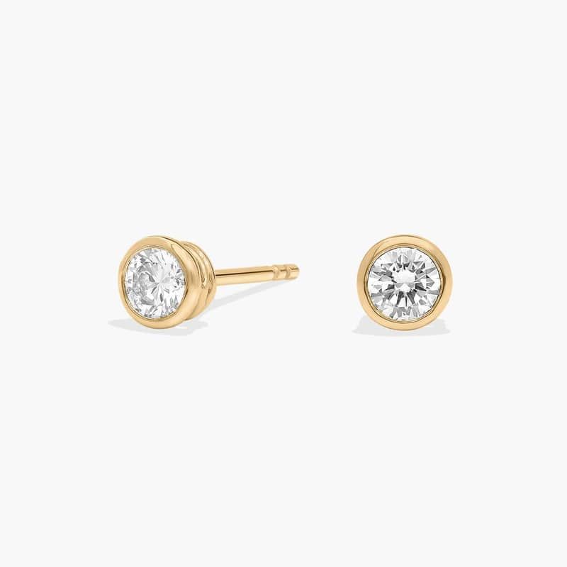 Bezel Set Lab-Grown Diamond Stud Earrings In 14K Yellow Gold (1/2