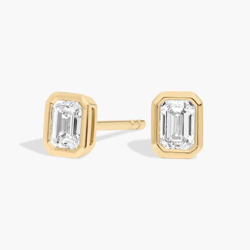 Bezel Set Emerald Cut Diamond Stud Earrings In 14K Yellow Gold (1/2 Ct. tw. - H-I / SI1-SI2)