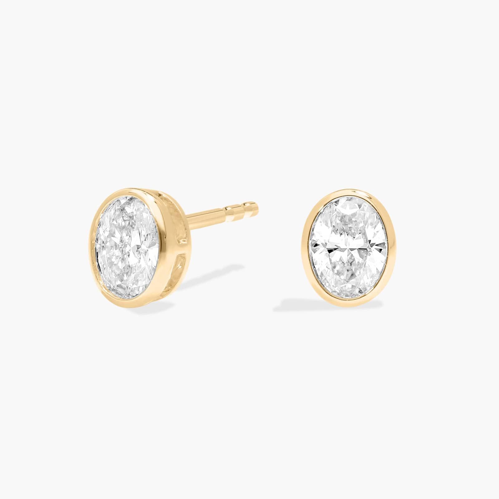 Bezel Stud Earrings With 0.5 CTW Oval Cut Lab-Grown Diamonds in 14K Yellow Gold