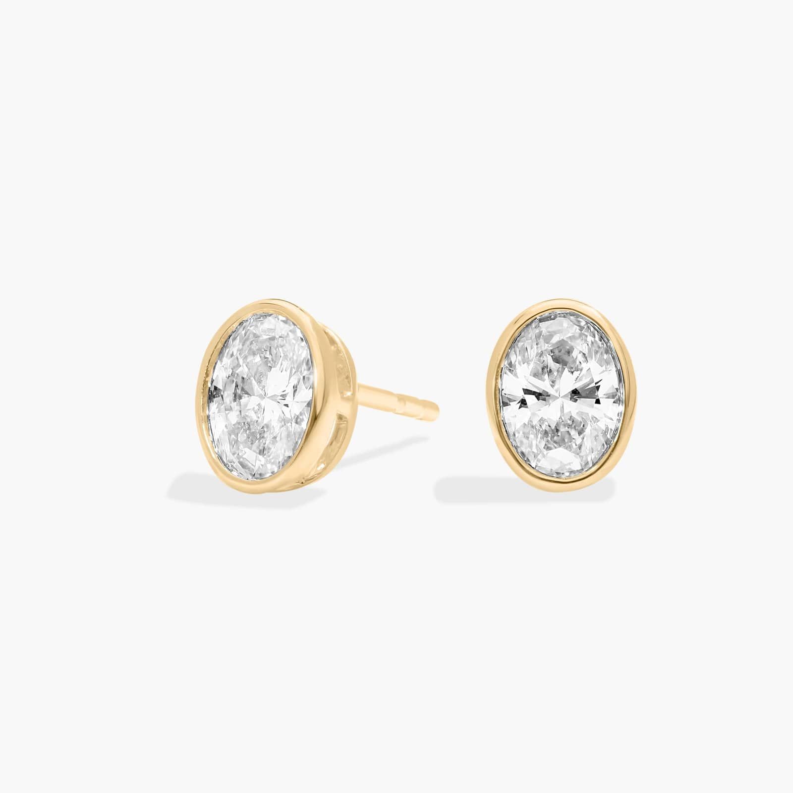 Bezel Stud Earrings With 0.75 CTW Oval Cut Lab-Grown Diamonds in 14K Yellow Gold