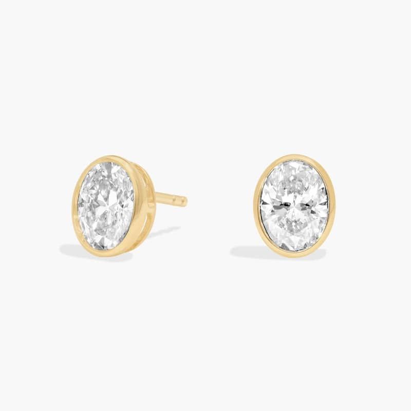 Bezel Diamond Stud Earrings With 1.5 CTW Oval Cut Diamonds in 14K Yellow Gold
