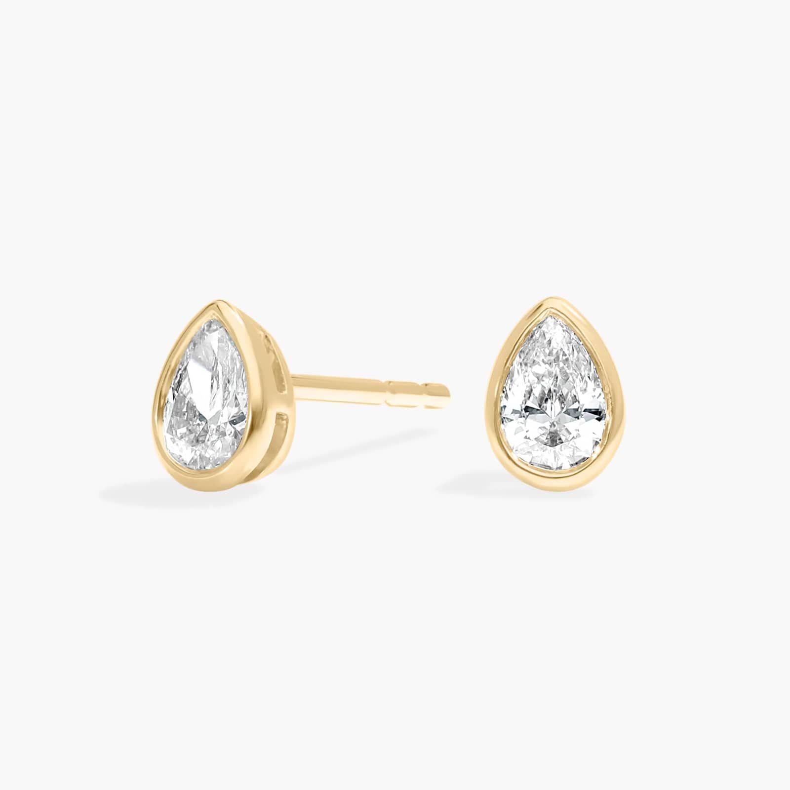 Bezel Diamond Stud Earrings With 0.25 CTW Pear Shaped Diamonds in 14K Yellow Gold