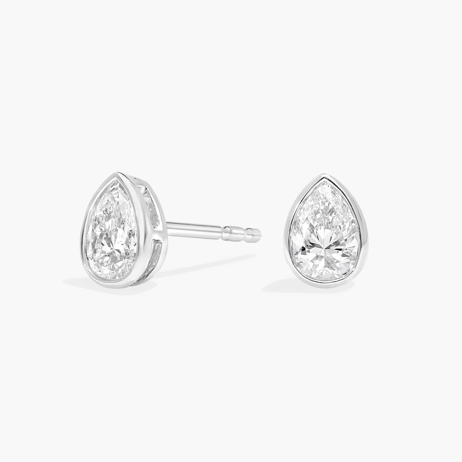 Bezel Diamond Stud Earrings With 0.5 CTW Pear Shaped Diamonds in Platinum