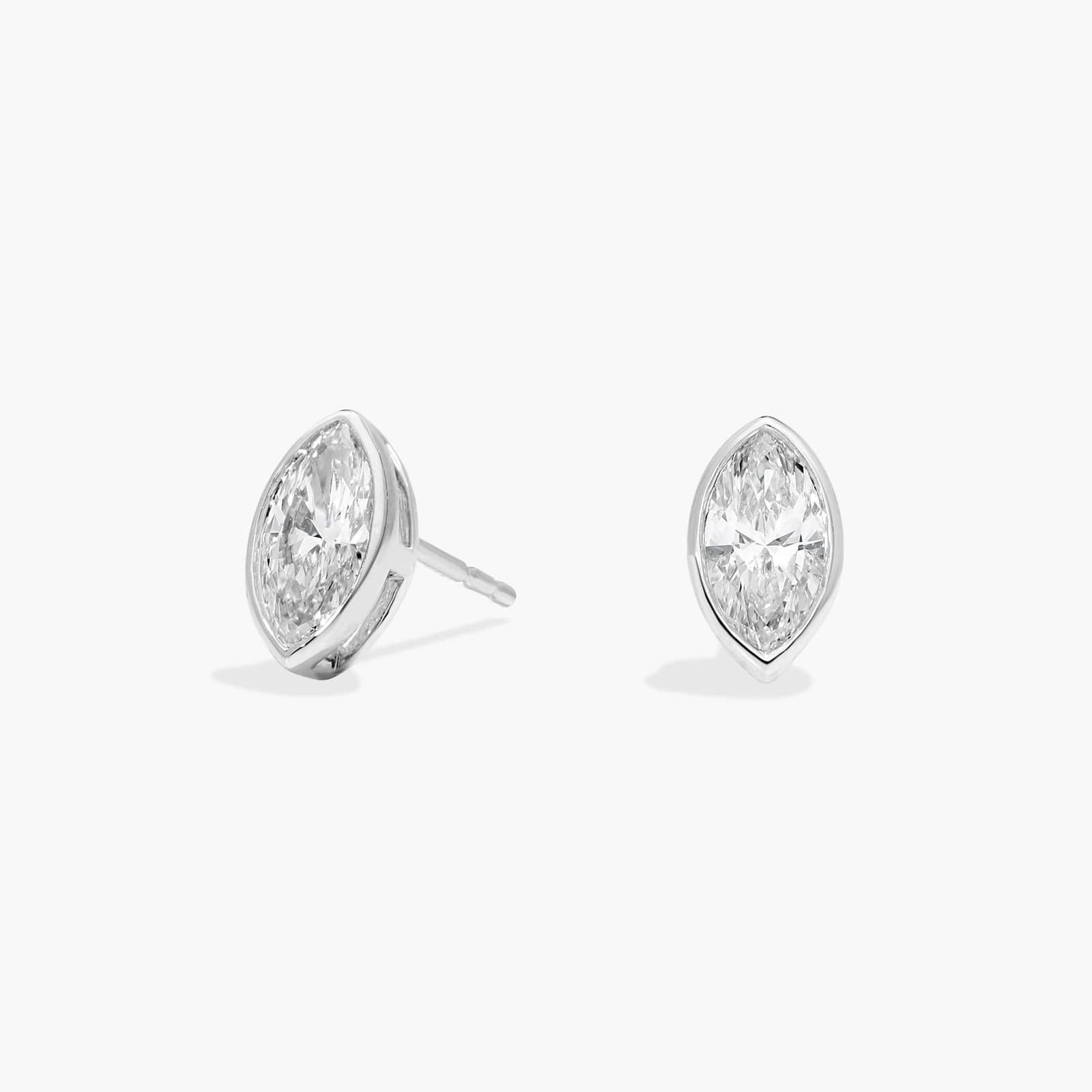Bezel Diamond Stud Earrings With 0.75 CTW Marquise Cut Diamonds in Platinum
