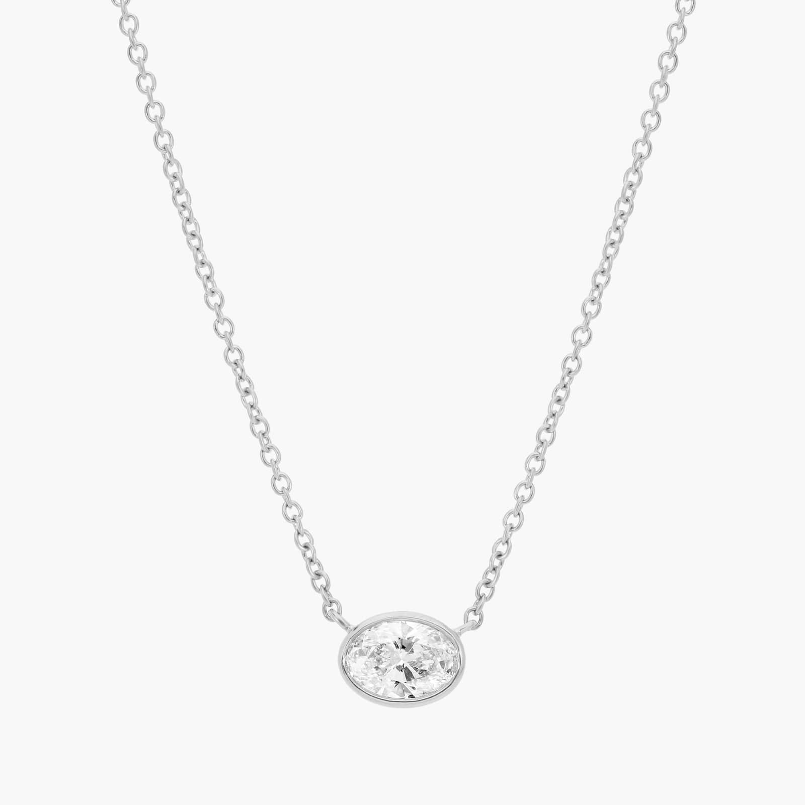 East-West Bezel Solitaire Pendant Necklace With 0.5 CTW Oval Cut Diamond in Platinum