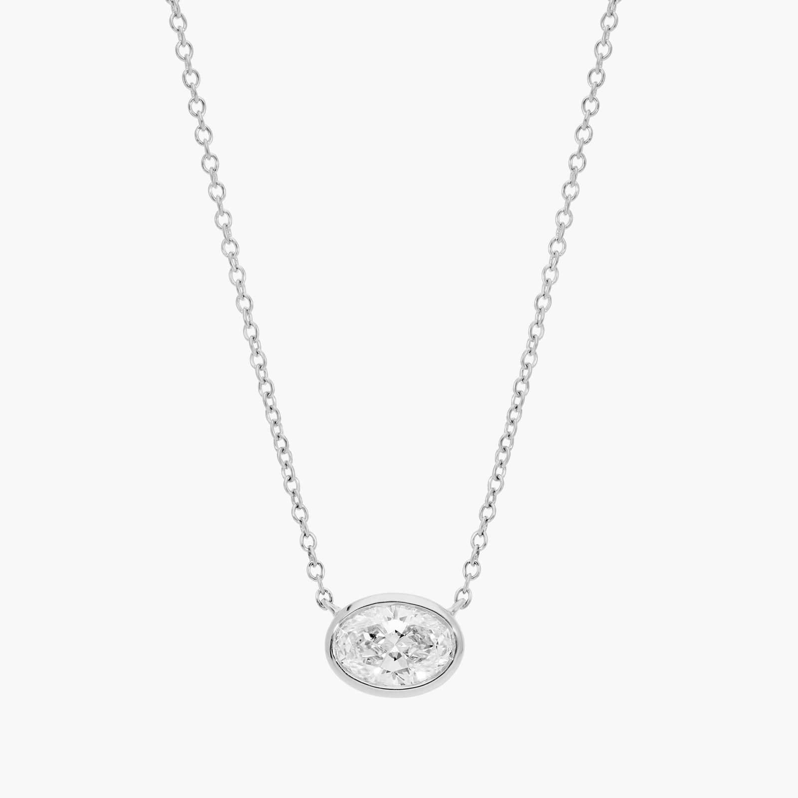 East-West Bezel Solitaire Pendant Necklace With 1 CTW Oval Cut Diamond in Platinum
