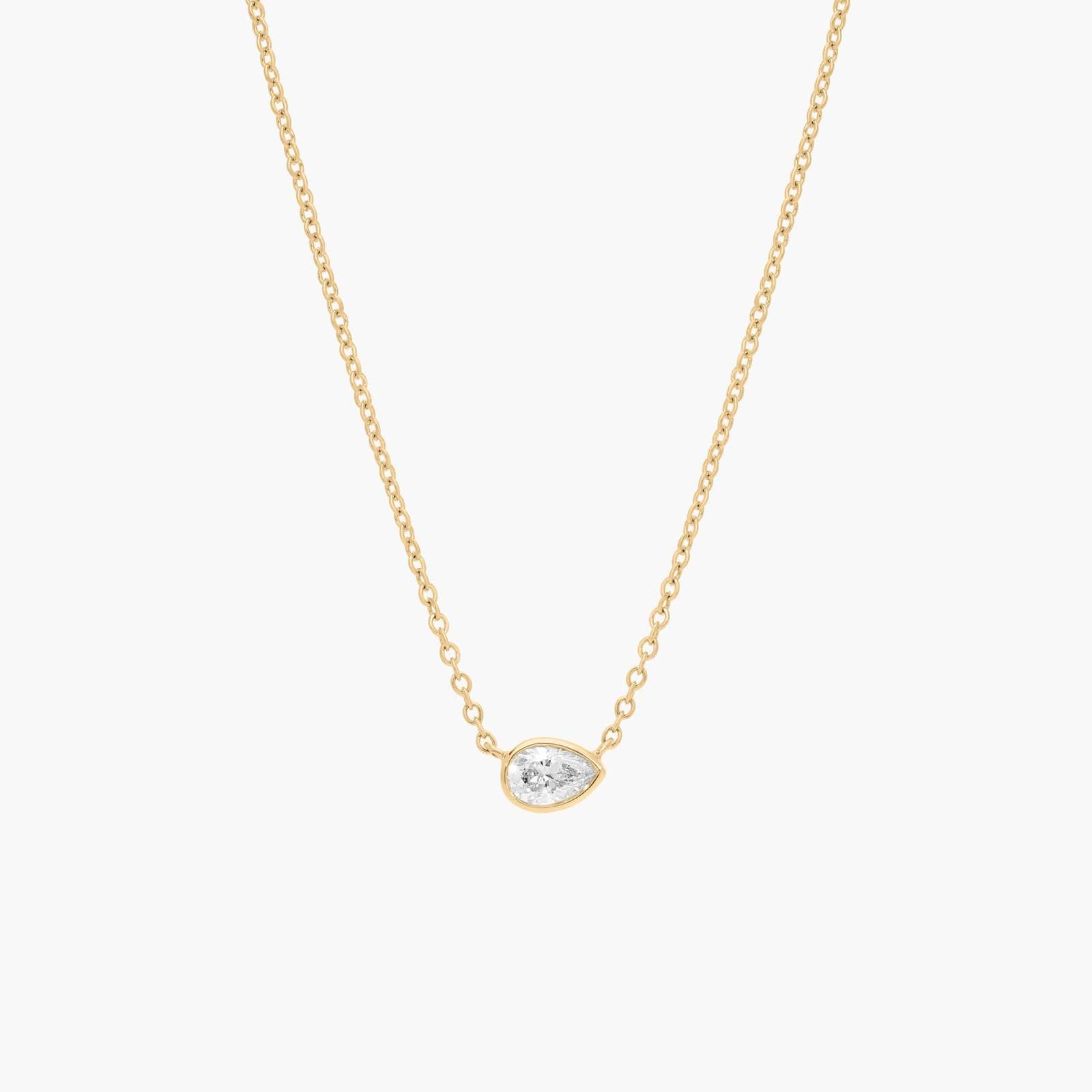 East-West Bezel Solitaire Pendant Necklace With 0.25 CTW Pear Shaped Diamond in 14K Yellow Gold