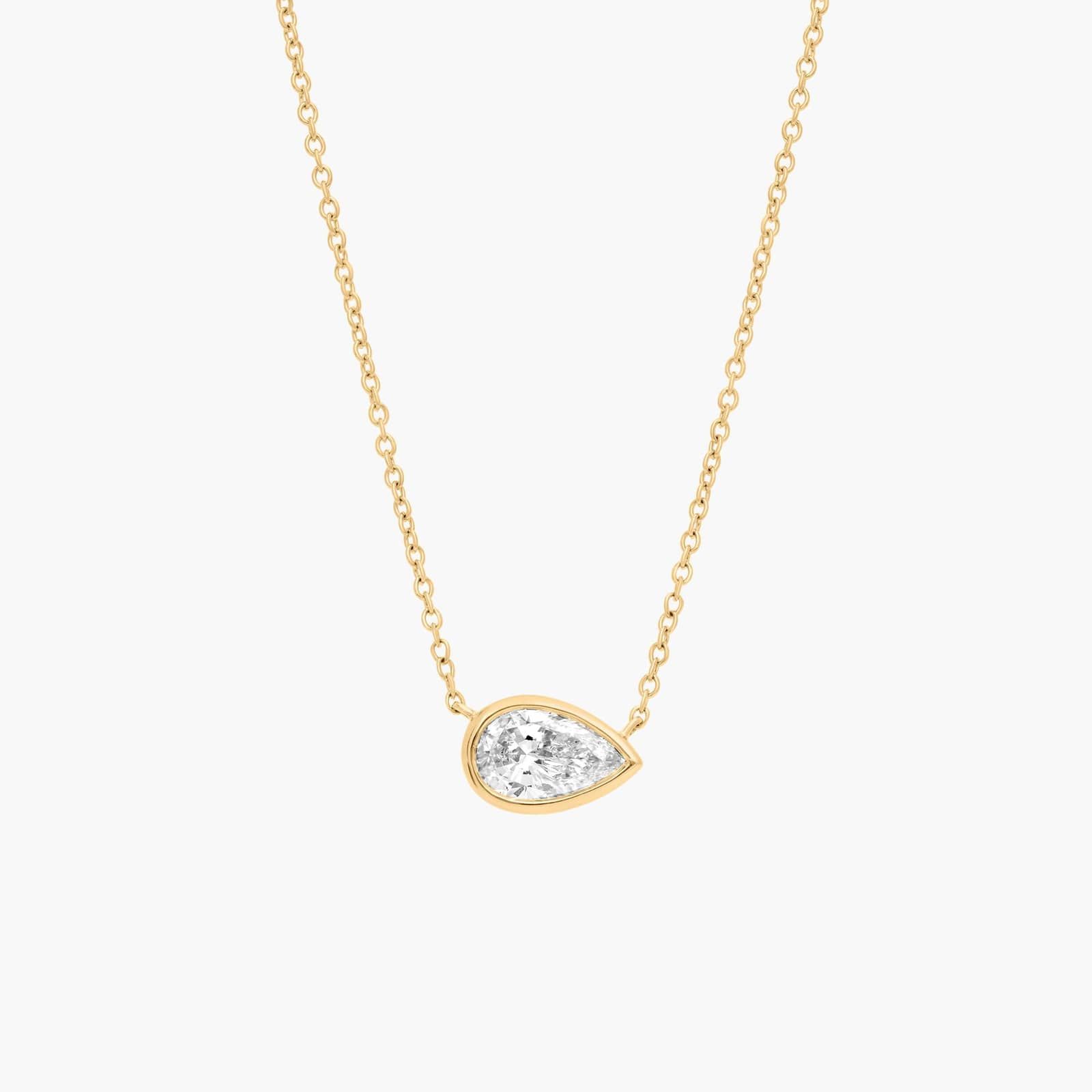 East-West Bezel Solitaire Pendant Necklace With 1 CTW Pear Shaped Diamond in 14K Yellow Gold