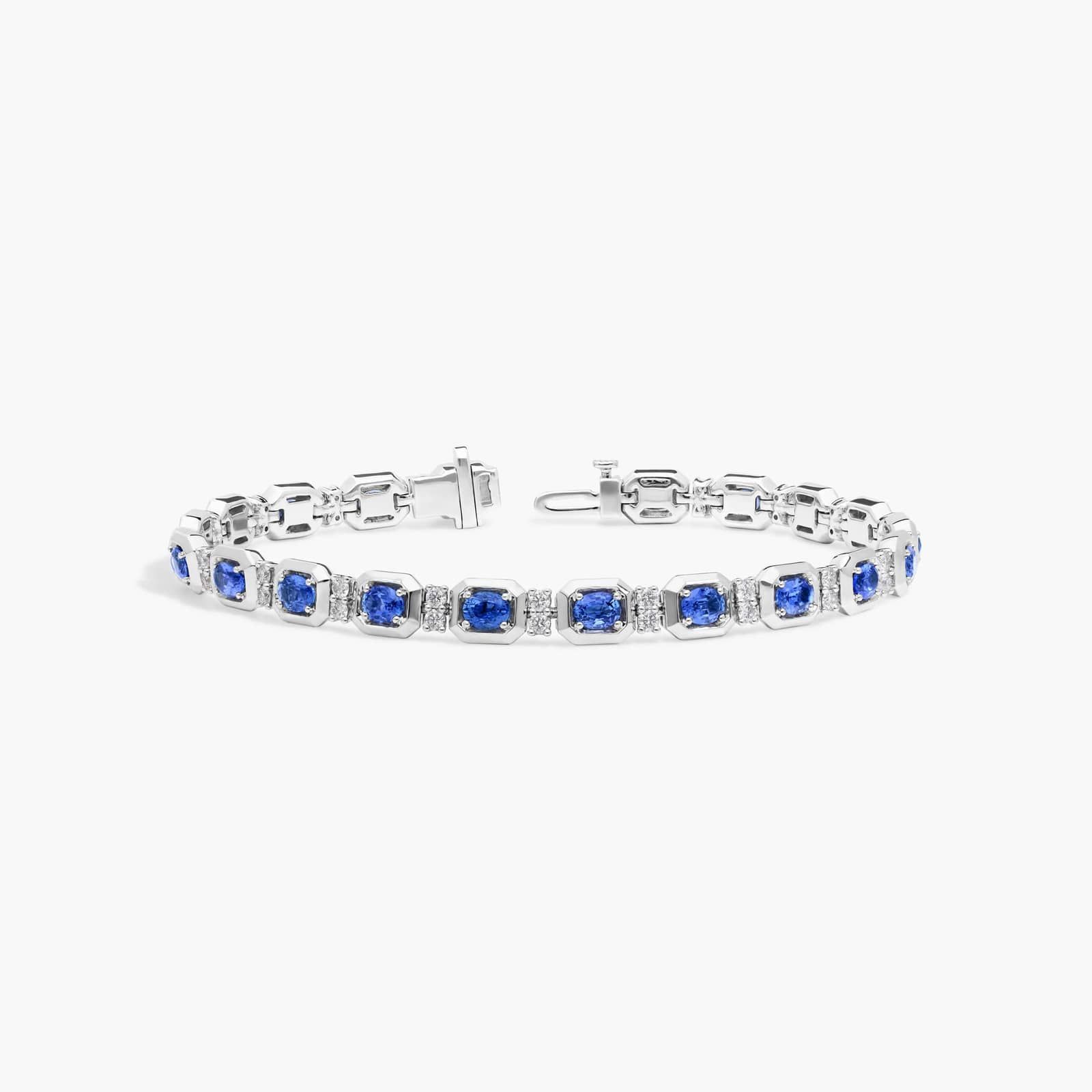 Oval Cut Blue Sapphire and Diamond Alternating Tennis Bracelet In 14K White Gold