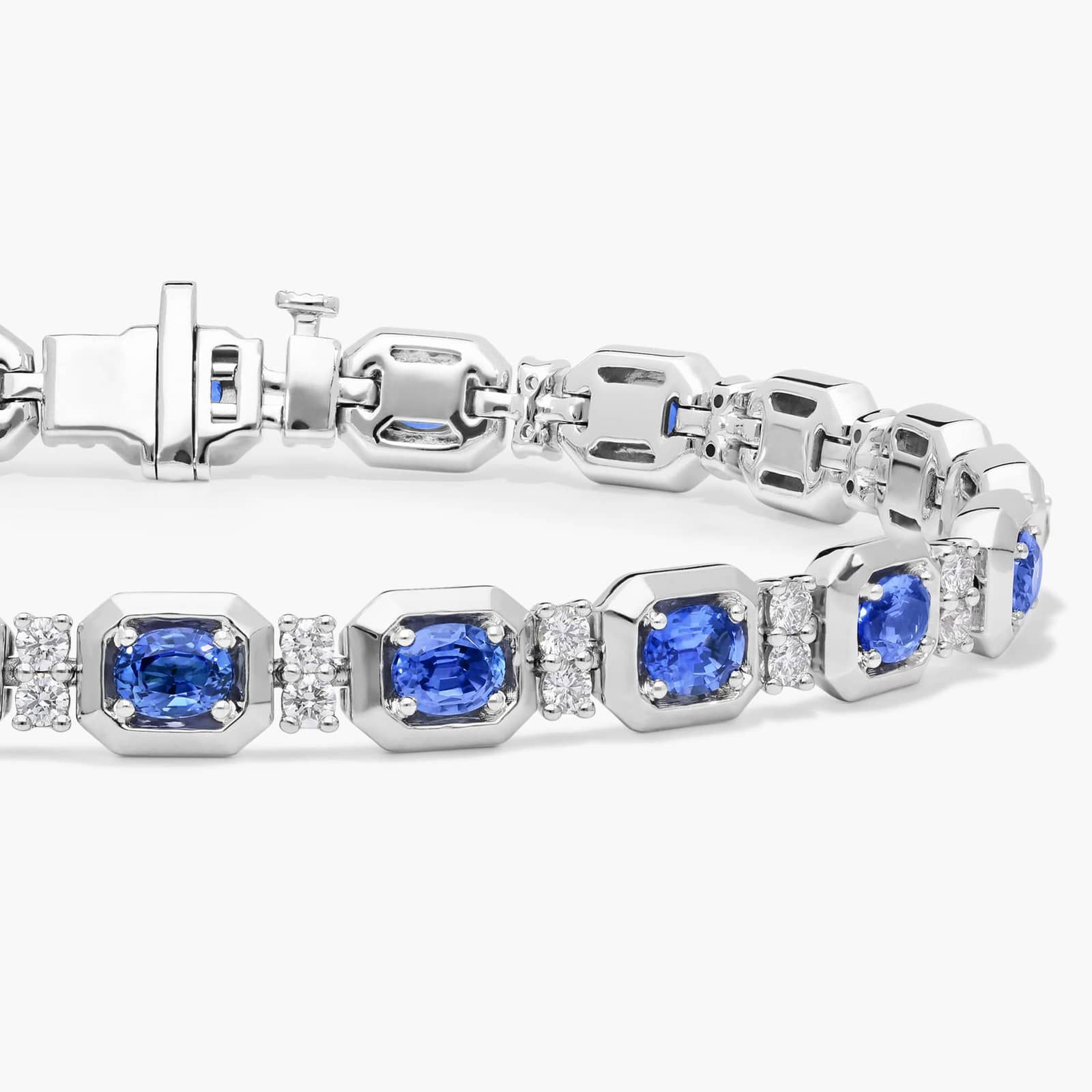 Oval Cut Blue Sapphire and Diamond Alternating Tennis Bracelet In 14K White Gold
