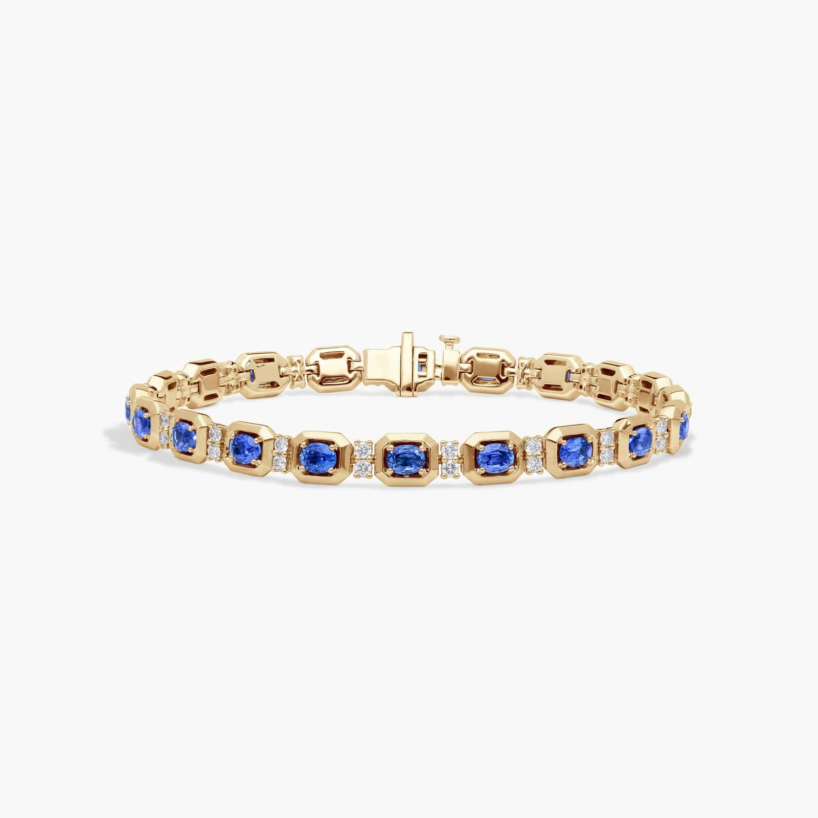 Oval Cut Blue Sapphire and Diamond Alternating Tennis Bracelet In 14K Yellow Gold