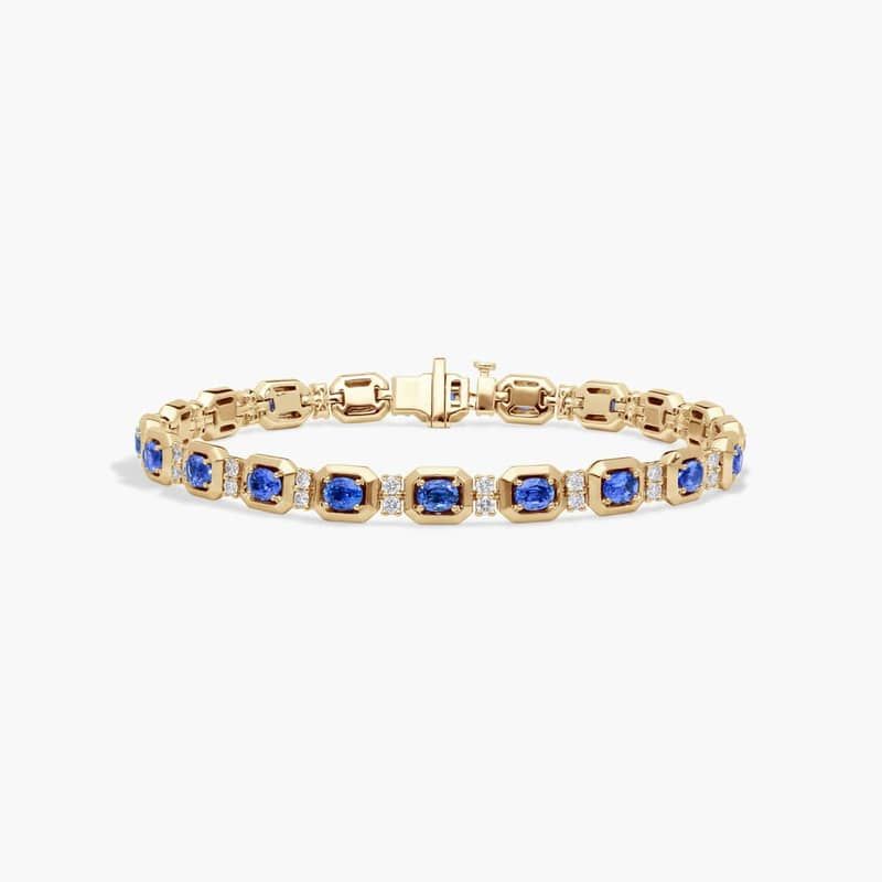 Oval Cut Blue Sapphire and Diamond Alternating Tennis Bracelet In 14K Yellow Gold