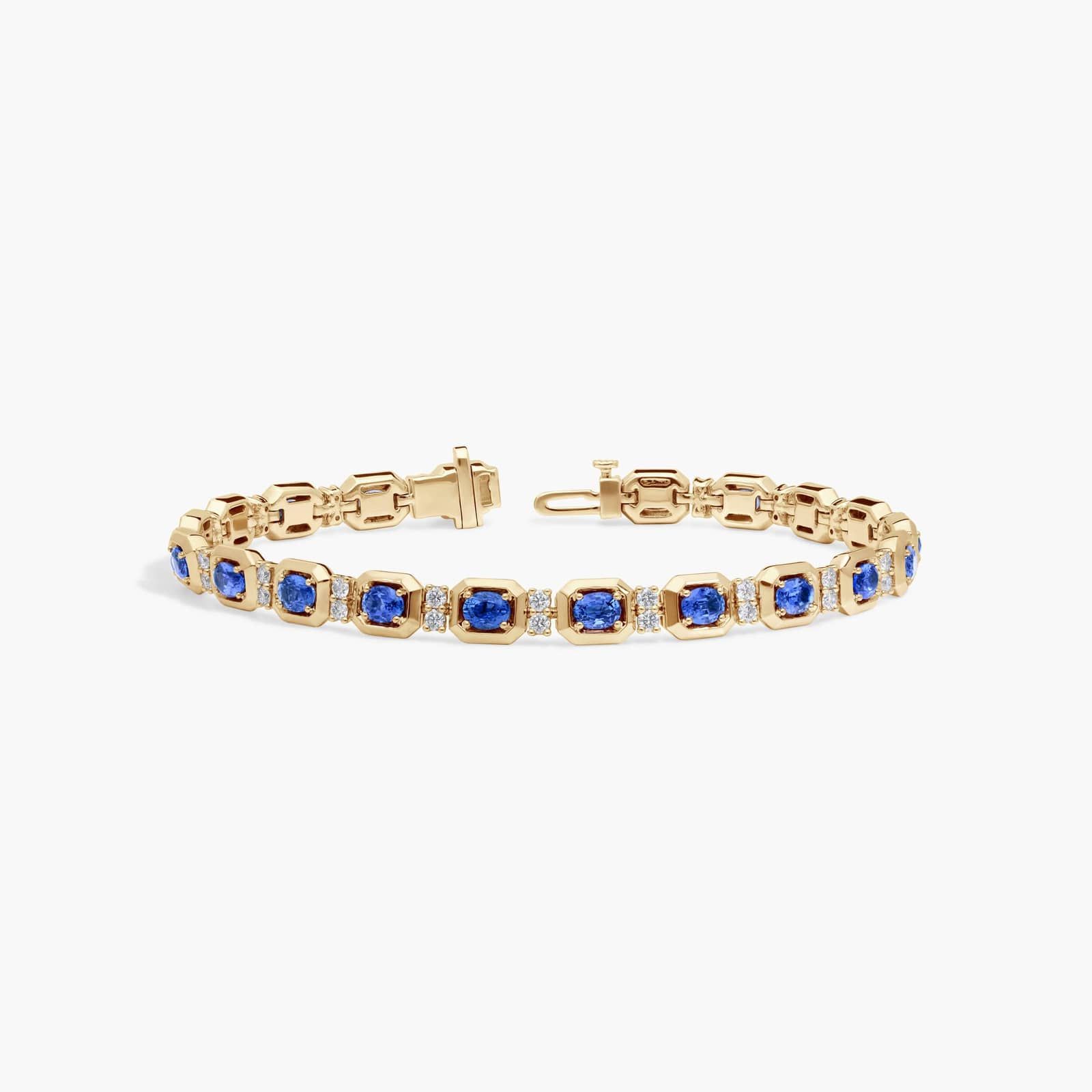 Oval Cut Blue Sapphire and Diamond Alternating Tennis Bracelet In 14K Yellow Gold