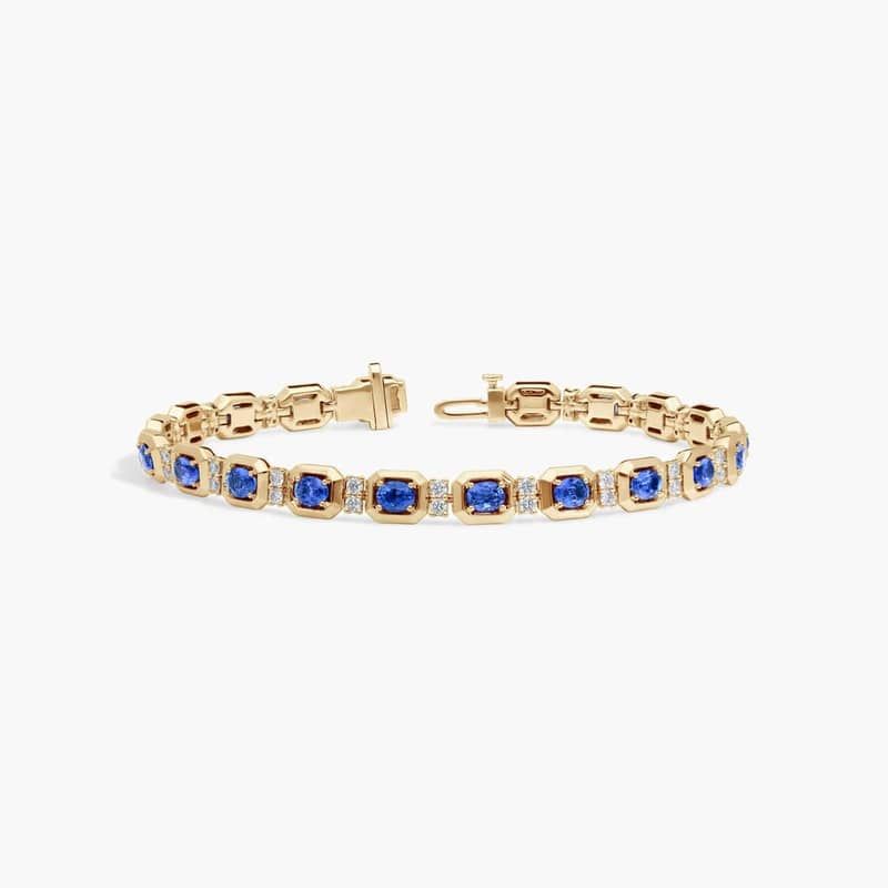 Oval Cut Blue Sapphire and Diamond Alternating Tennis Bracelet In 14K Yellow Gold