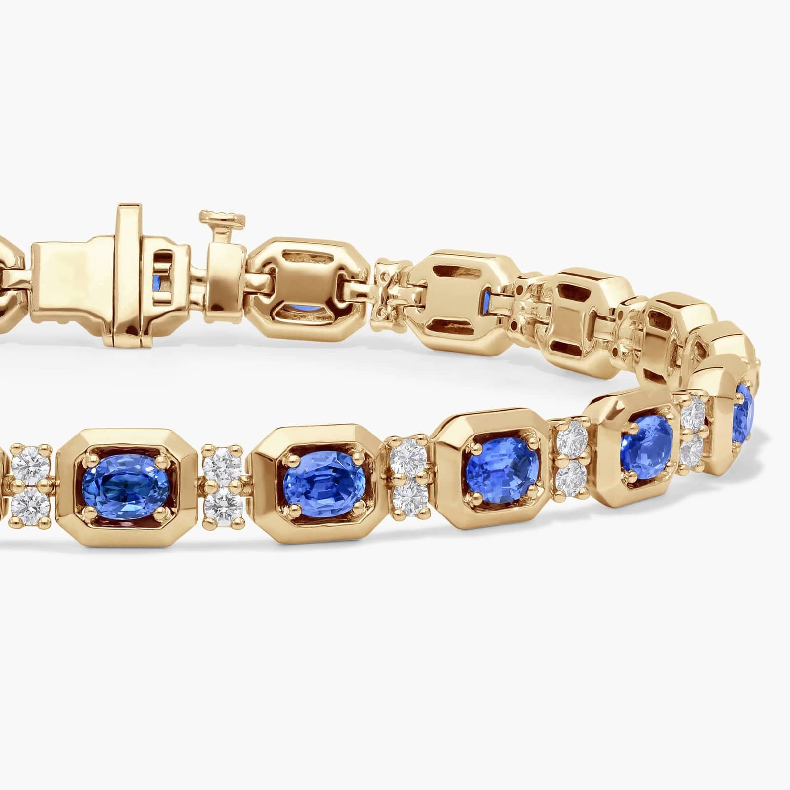 Oval Cut Blue Sapphire and Diamond Alternating Tennis Bracelet In 14K Yellow Gold