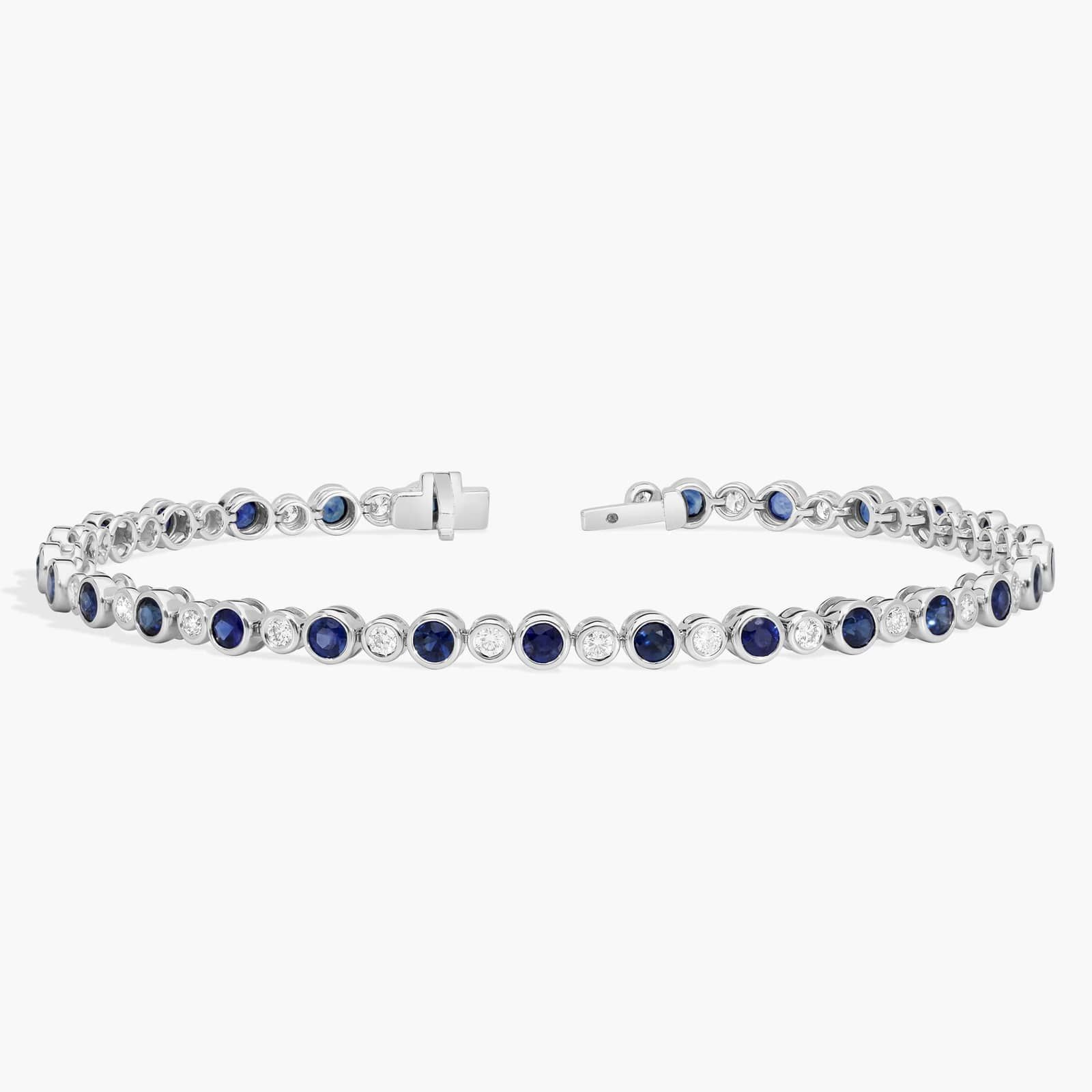 Alternating Blue Sapphire and Diamond Bracelet with 0.75 CTW Round Cut Diamonds in 14K White Gold Bezel Setting