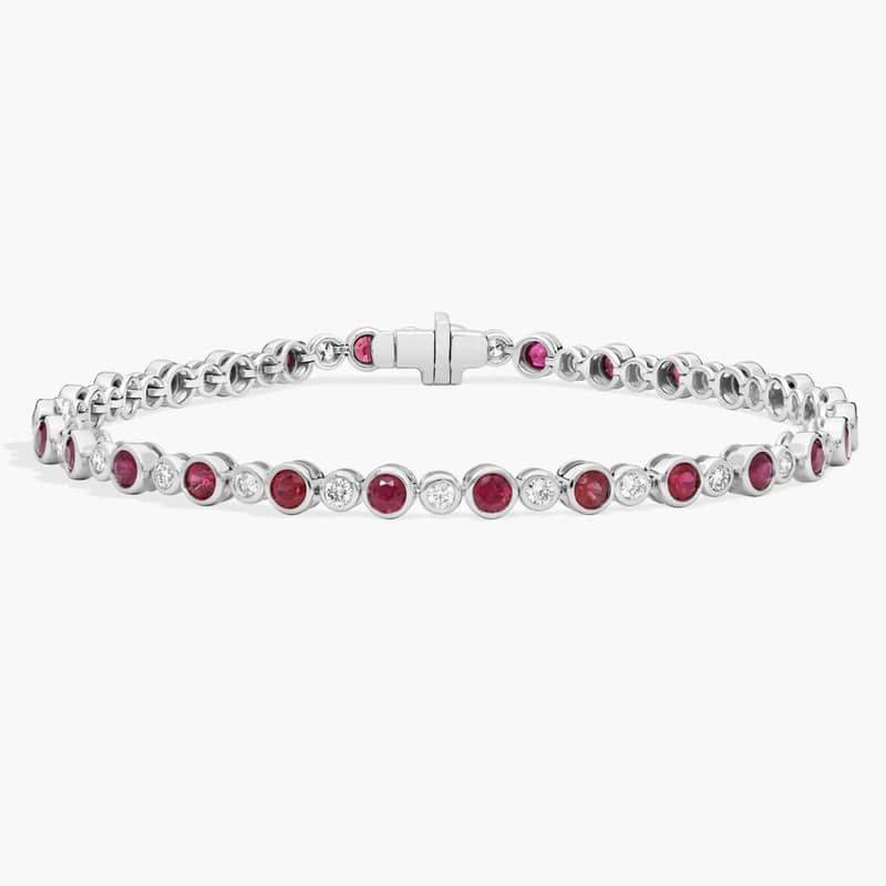 Alternating Ruby and Diamond Bracelet with 0.75 CTW Round Cut Diamonds in 14K White Gold Bezel Setting