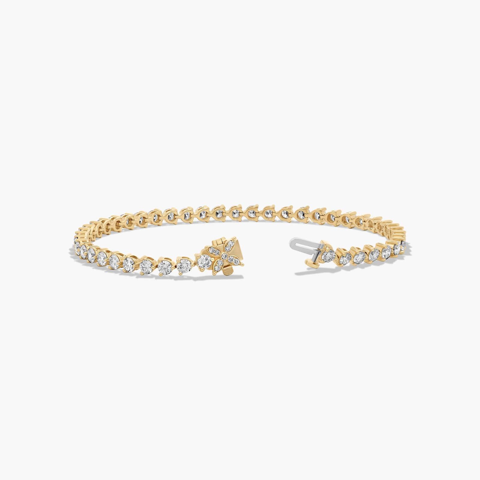 Flower Clasp Tennis Bracelet With 5 CTW Diamonds In 14K Yellow Gold By James Allen