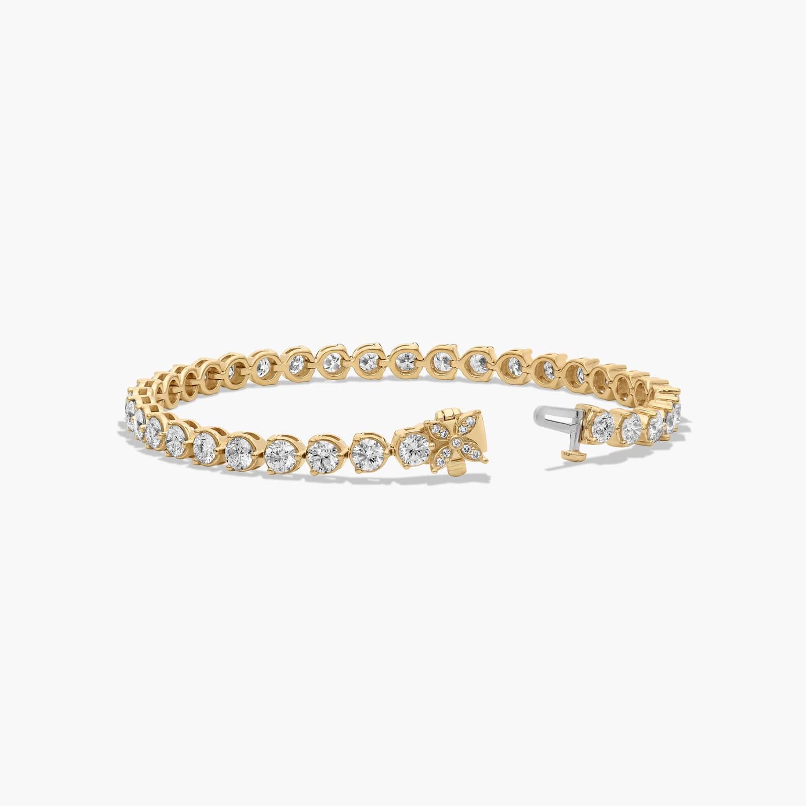 Flower Clasp Tennis Bracelet With 7 CTW Diamonds In 14K Yellow Gold By James Allen