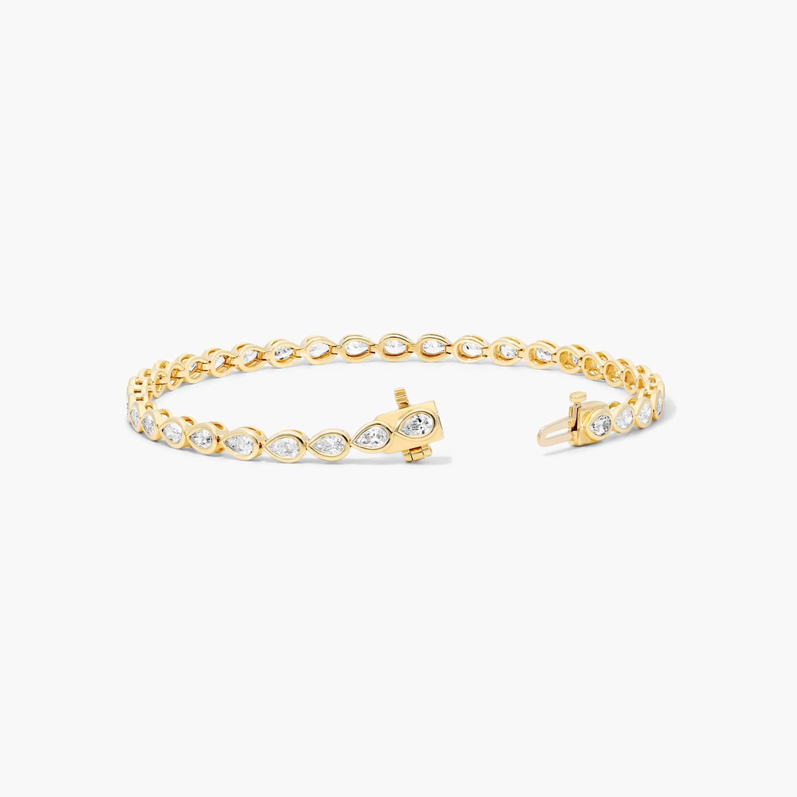Bezel Tennis Bracelet With Pear Cut Diamonds In 14K Yellow Gold By James Allen