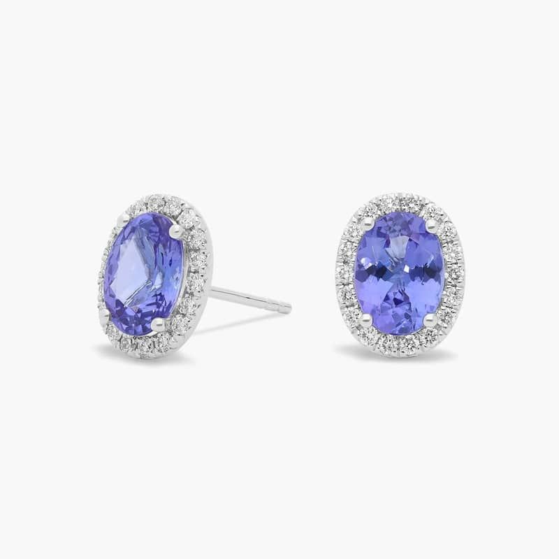 Oval Tanzanite and Diamond Halo Stud Earrings in 14k White Gold (5x7mm)