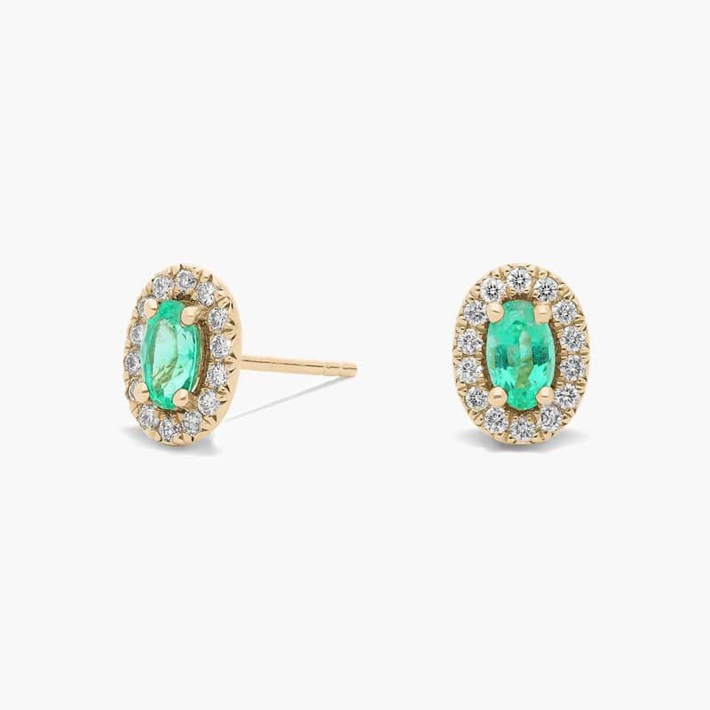 Oval Emerald Halo Stud Earrings in 14k Yellow Gold (5x3mm)