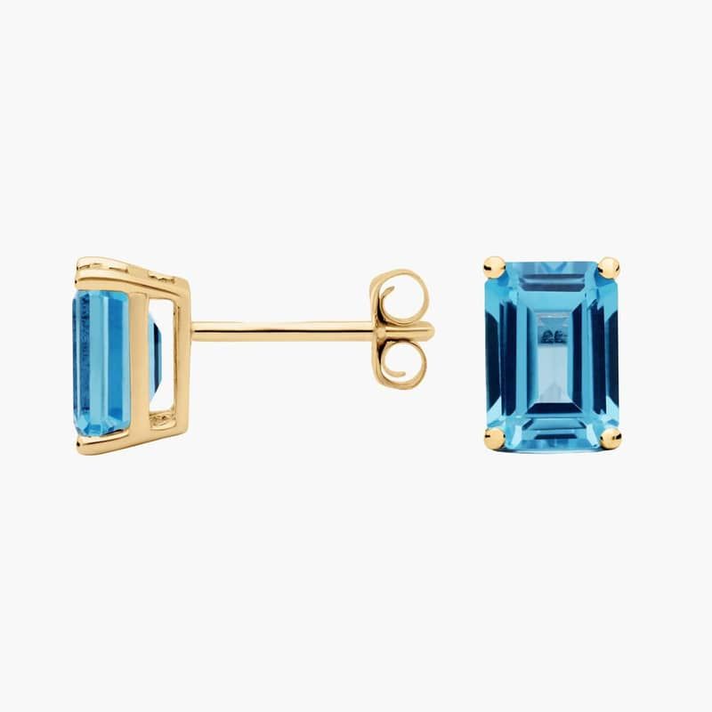 Emerald Cut Birthstone Blue Topaz Stud Earrings in 14K Yellow Gold (7x5mm)