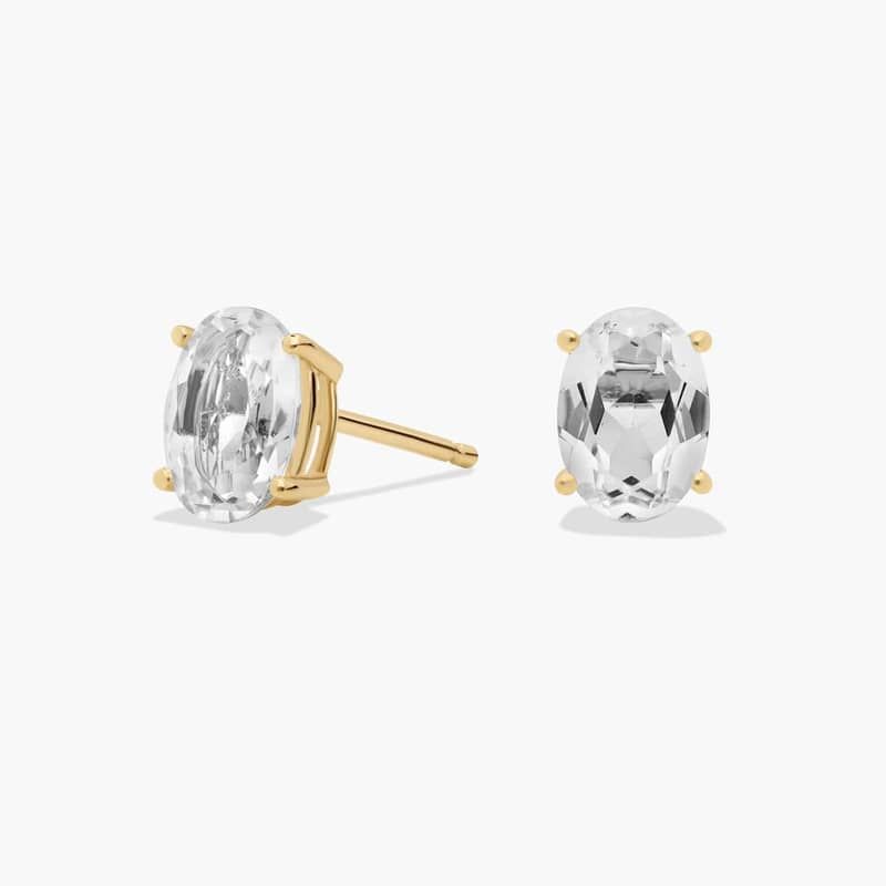 Oval Birthstone White Topaz Stud Earrings in 14K Yellow Gold (7x5mm)