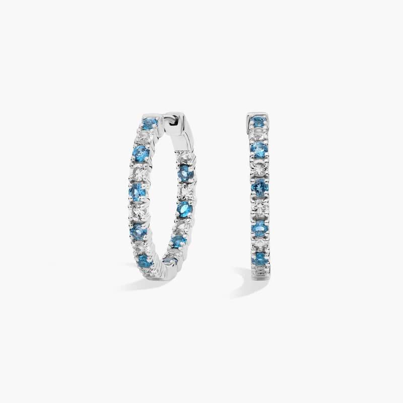 Alternating Blue and White Topaz Eternity Hoop Earrings in Sterling Silver