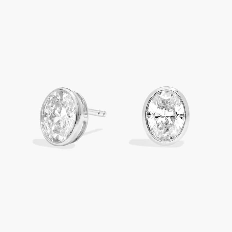 Bezel Diamond Stud Earrings With 1.5 CTW Oval Cut Diamonds in 14K White Gold