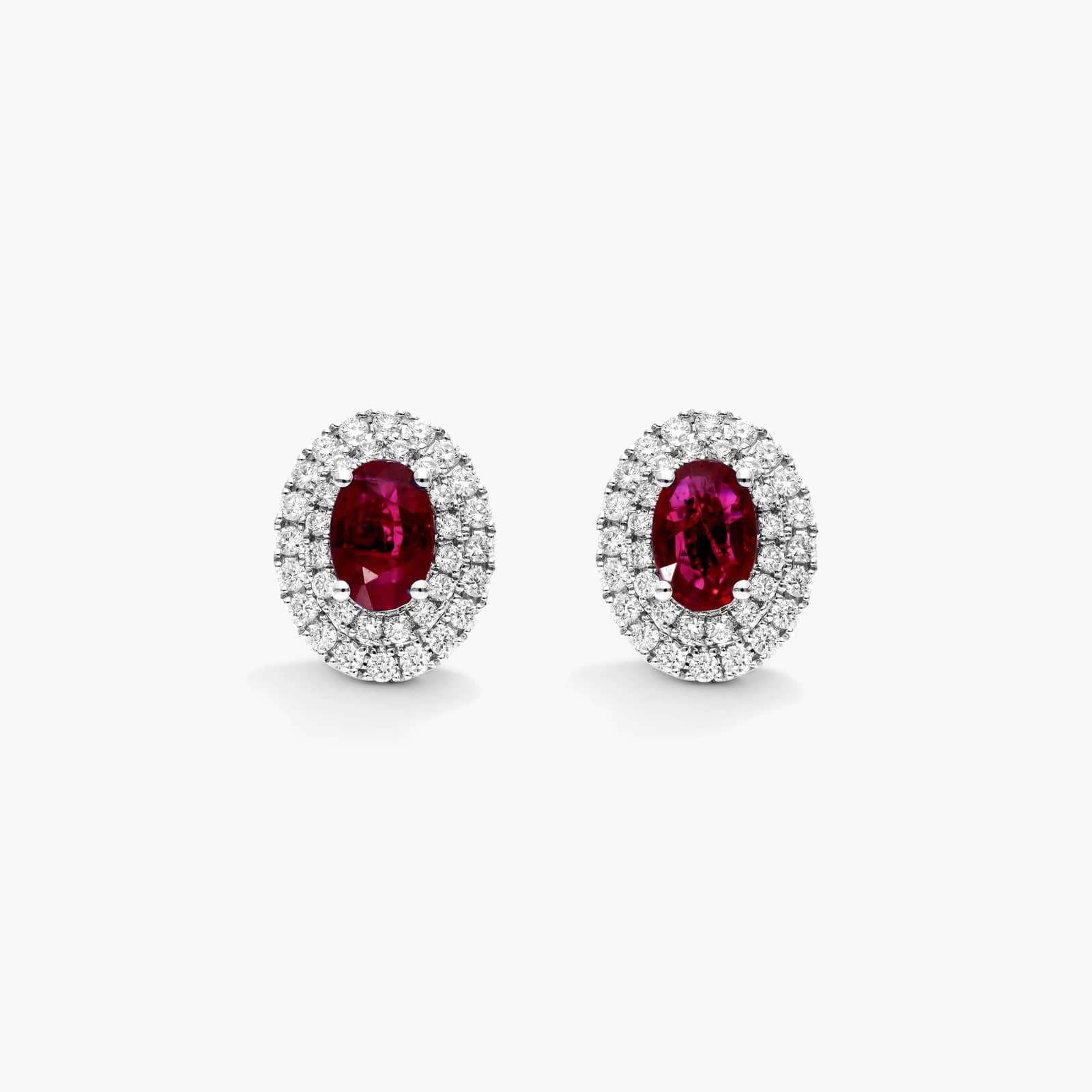 Oval Cut Ruby And Diamond Double Halo Earrings In 18K White Gold