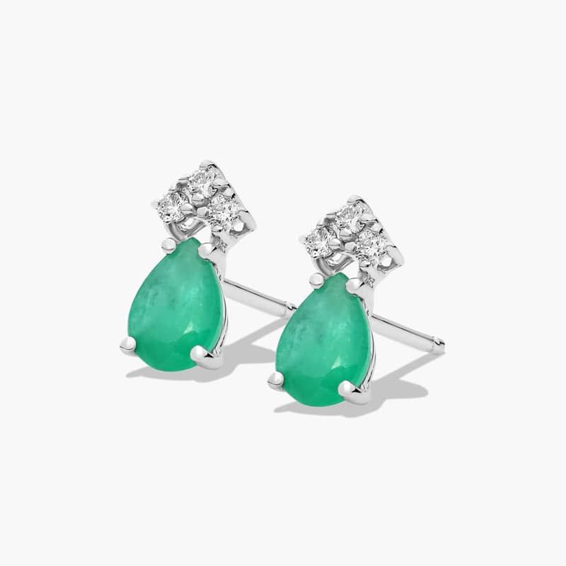 Pear Shape Emerald And Tri-Diamond Stud Earrings In 14K White Gold